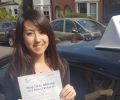 Marie with Driving test pass certificate